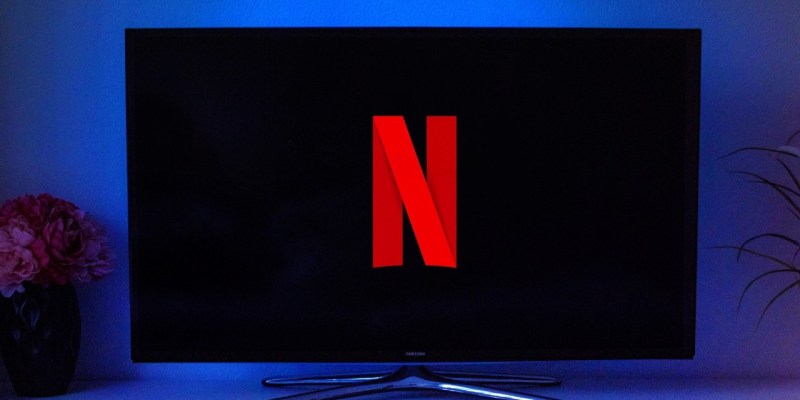 Netflix logo displayed on TV screen. The password sharing crackdown is paying dividends for Netflix.