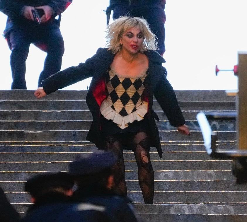 Joker: Folie à Deux (Joker 2) production photos show Lady Gaga and Joaquin Phoenix in full makeup on the first movie iconic concrete stairs.