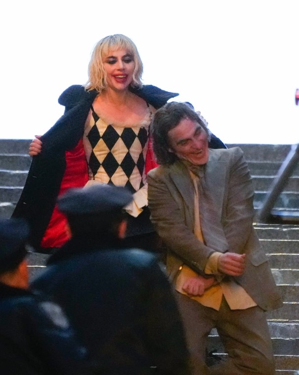 Joker: Folie à Deux (Joker 2) production photos show Lady Gaga and Joaquin Phoenix in full makeup on the first movie iconic concrete stairs.