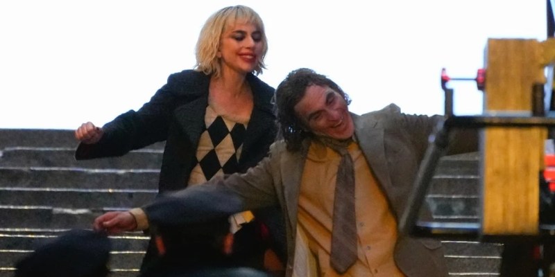 Joker: Folie à Deux (Joker 2) production photos show Lady Gaga and Joaquin Phoenix in full makeup on the first movie iconic concrete stairs.