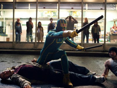 Kick Ass fighting bad guys. This image is part of an article about how Kick-Ass 3 is actually part of a trilogy, connects to the original films.