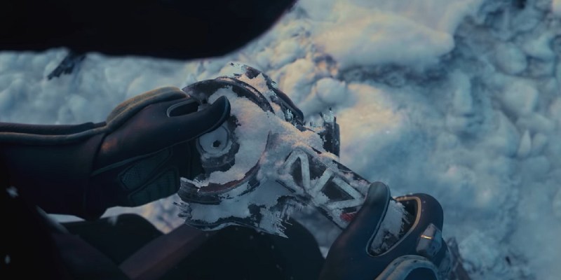 Image of N7 tech buried in the snow in a Mass Effect game.