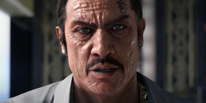 An image of Danny Trejo as Dwight in Like a Dragon: Infinite Wealth. He's a scarred-faced man with a tattoo above his right eyebrow.