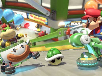 Mario Kart 8 Deluxe with two racers throwing shells at each other.