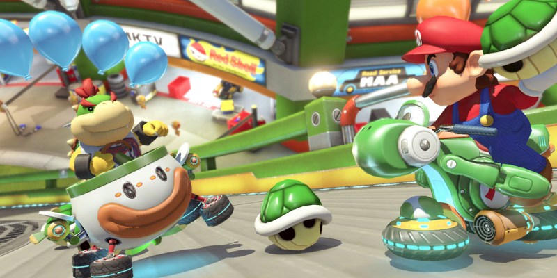 Mario Kart 8 Deluxe with two racers throwing shells at each other.