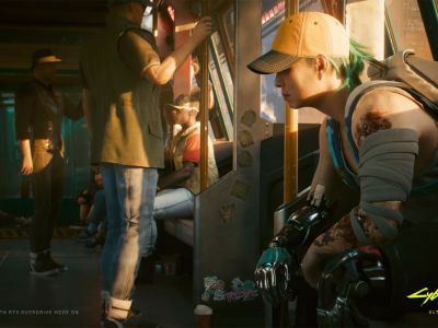 A woman sits on a Metro train in a still from Cyberpunk 2077.