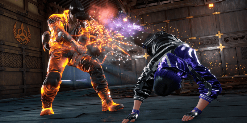 Image of a man getting kicked in the face by another man in a dimly-lit room in Tekken 8.