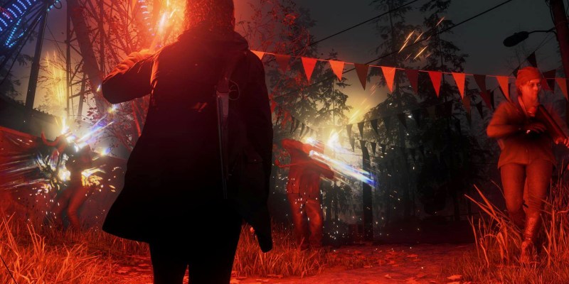 A woman in a coat, facing enemies in an area lit by red lighting in Alan Wake 2. This image is part of an article about patch notes for Alan Wake 2 Update 13: The Final Draft.