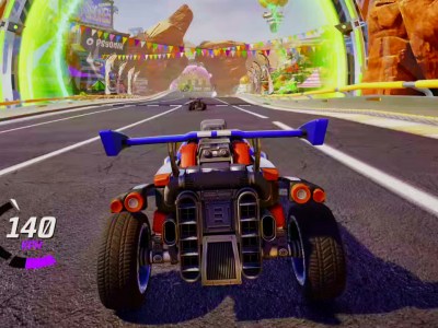 Fortnite Rocket Racing. A car zooming along a brightly-coloured track.