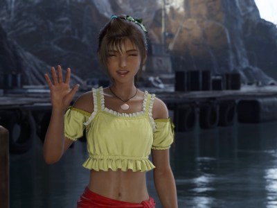 Priscilla in Final Fantay 7 Rebirth. She's wearing a yellow and white top and waving at the screen.