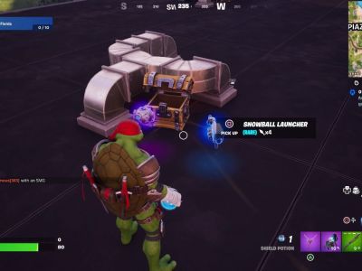 A Snowball Launcher outside a chest in Fortnite.