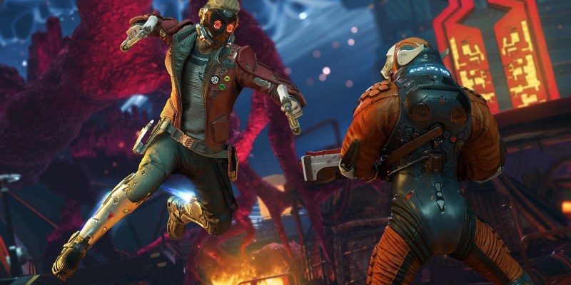 Image of man in red leather jacket and techno facemask preparing to hit an alien man with his gun.