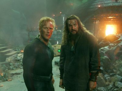 Orm and Arthur stand amid rubble