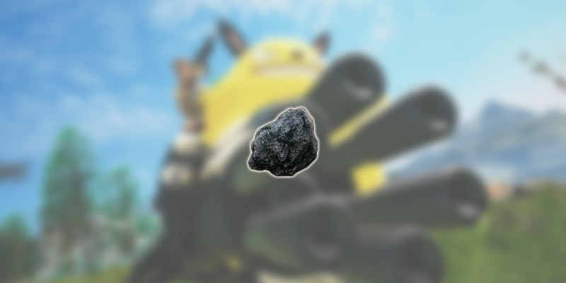 An image of the coal resource in Palworld against a blurred backdrop showing one of the Pals with a gatling gun.