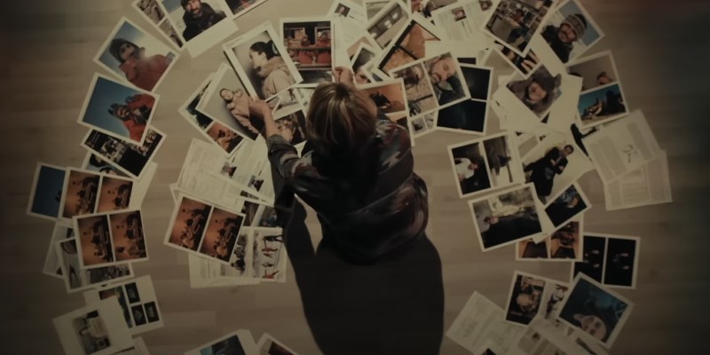 Liz Danvers with a spiral of photos in True Detective: Night Country