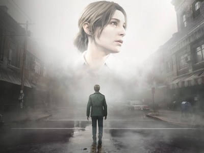 An image of the Silent Hill 2 remake, with a man in a green jacket standing in a town looking at a ghostly image of a giant woman's head.